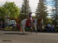 Miss Rodeo Canada leading the Whoop-Up Days parade aboard Blue Eyed Storm
